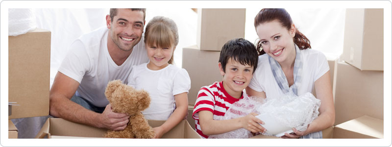 Family packing household items for their move