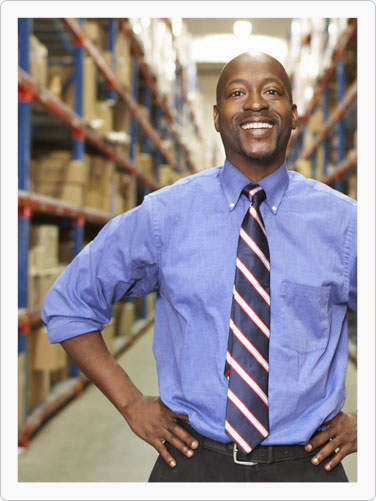 Moving association representative standing in warehouse