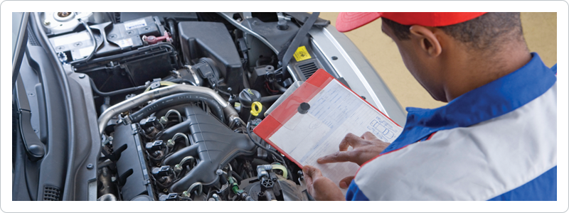 Mechanic performing vehicle inspection